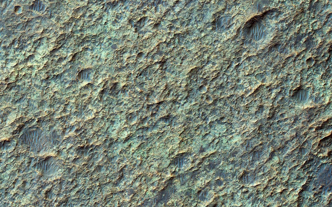 This image from NASA Mars Reconnaissance Orbiter spacecraft the valley networks on Mars are terrains eroded by flowing water billions of years ago. Where bedrock is well exposed, a variety of colors due to altered minerals and polygonal patterns.