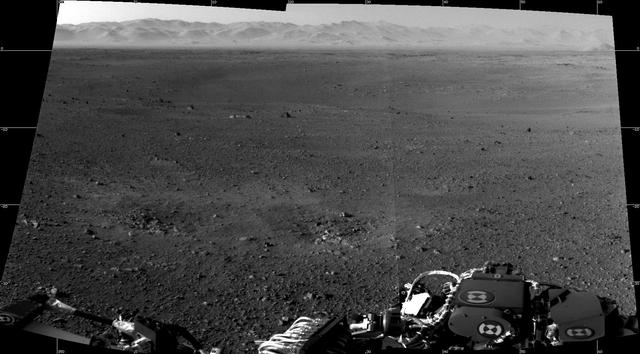 These are the first two full-resolution images of the Martian surface from the Navigation cameras on NASA Curiosity rover, which are located on the rover head or mast. The rim of Gale Crater can be seen in the distance beyond the pebbly ground.