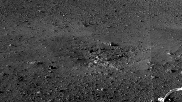 This is a close-up view of the zones where the soil at Curiosity landing site was blown away by the thrusters on the rover descent stage. The excavation of the soil reveals probable bedrock outcrop.