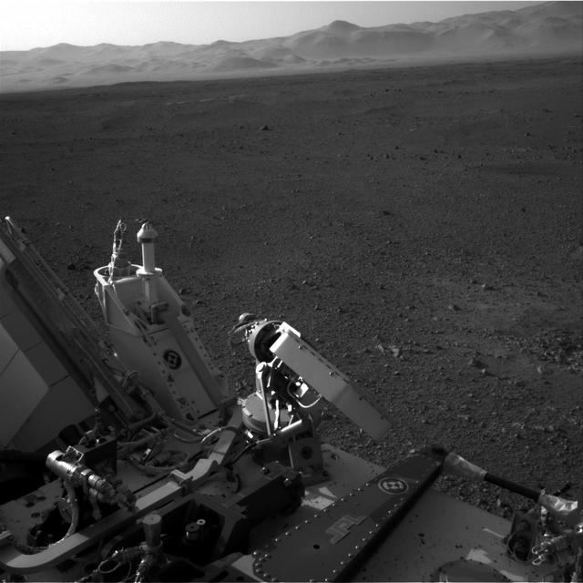 This full-resolution image shows part of the deck of NASA Curiosity rover taken from one of the rover Navigation cameras looking toward the back left of the rover. On the left, part of the rover power supply is visible.