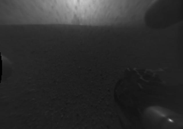 This image was taken by the Hazard-Avoidance cameras on NASA Curiosity rover to show evidence for an impact plume created when the rover sky crane fell to the Martian surface.