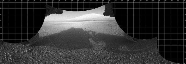 The Curiosity engineering team created this cylindrical projection view from images taken by NASA Curiosity rover front hazard avoidance cameras underneath the rover deck on Sol 0. Pictured here are are the pigeon-toed the wheels.