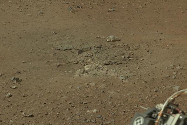 This cropped image from NASA Curiosity rover shows one set of marks on the surface of Mars where blasts from the descent-stage rocket engines blew away some of the surface material.