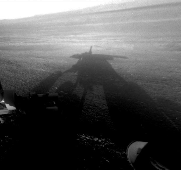 NASA Mars Exploration Rover Opportunity captured this view of its afternoon shadow stretching into Endeavour Crater during the 3,051st Martian day, or sol, of Opportunity work on Mars Aug. 23, 2012.