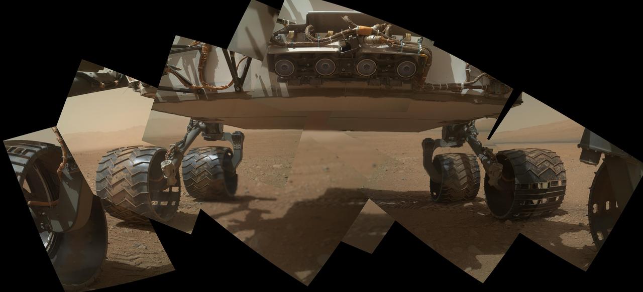 This view of the lower front and underbelly areas of NASA Mars rover Curiosity combines nine images taken by the rover MAHLI camera during the 34th Martian day, or sol, of Curiosity work on Mars.