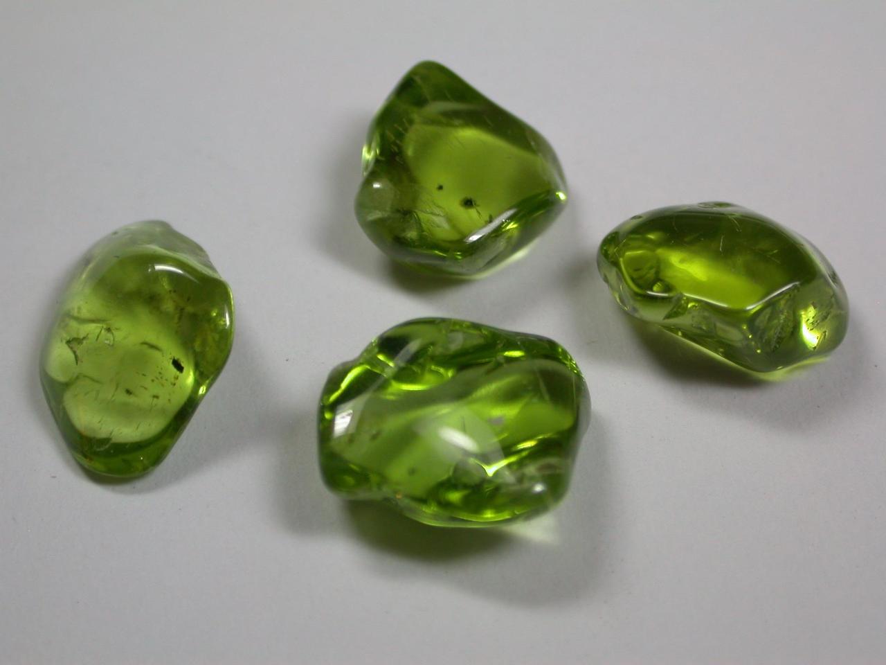 The semi-precious gem peridot is a variety of olivine. NASA Curiosity rover shows the diffraction signature, or fingerprint, of the mineral olivine, shown here on Earth in the form of tumbled crystals.