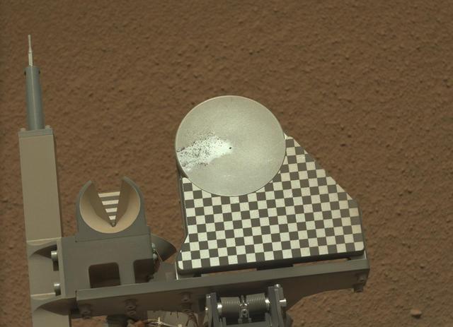 The robotic arm on NASA Mars rover Curiosity delivered a sample of Martian soil to the rover observation tray for the first time during the mission 70th Martian day, or sol Oct. 16, 2012.