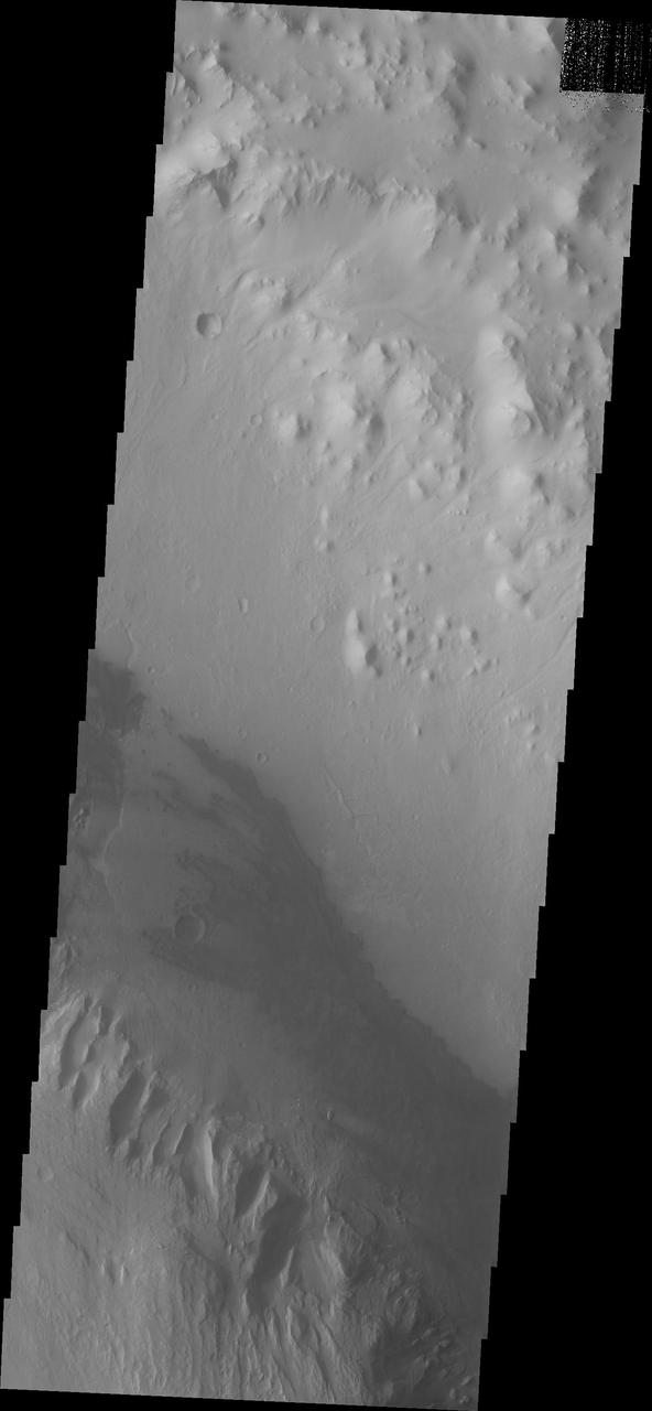Continuing eastward, this image of Gale captured by NASA 2001 Mars Odyssey spacecraft shows the reappearance of dunes on the crater floor near the margin of Mt. Sharp.