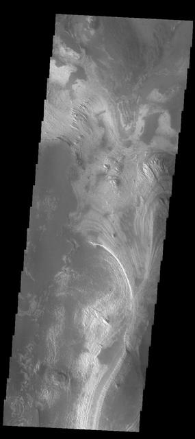 This image captured by NASA 2001 Mars Odyssey spacecraft shows the part of the floor of Melas Chasma. Melas Chasma in the central chasma of Valles Marineris.