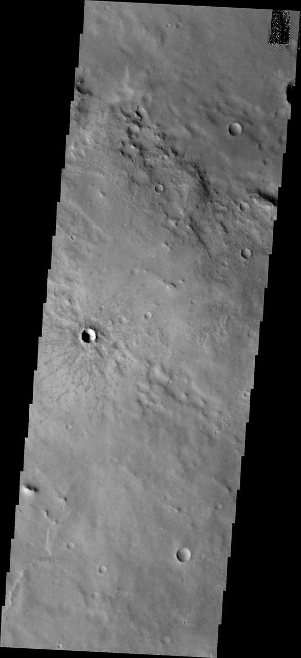 This image captured by NASA 2001 Mars Odyssey spacecraft shows Winslow Crater, a fairly young crater. The darker rayed ejecta is still visible surrounding the crater.