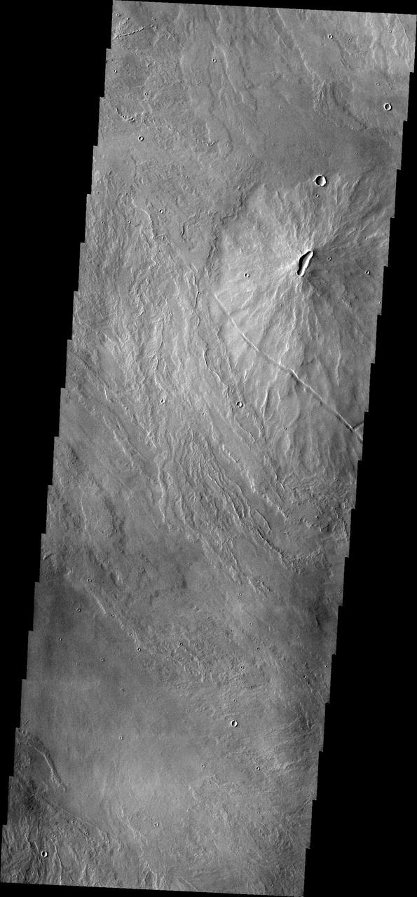 A volcanic vent has created a small construct a volcano in this region of Tharsis east of Arsia Mons. This image is from NASA 2001 Mars Odyssey spacecraft.