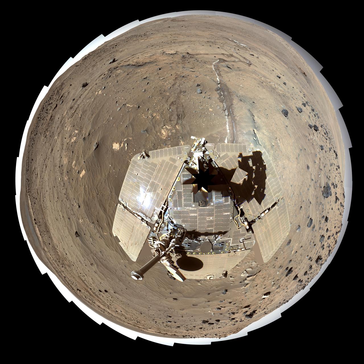 This self-portrait of NASA Mars Exploration Rover Spirit is a false color polar projection of the 360-degree McMurdo panorama made from images taken by Spirit from April through October 2006.