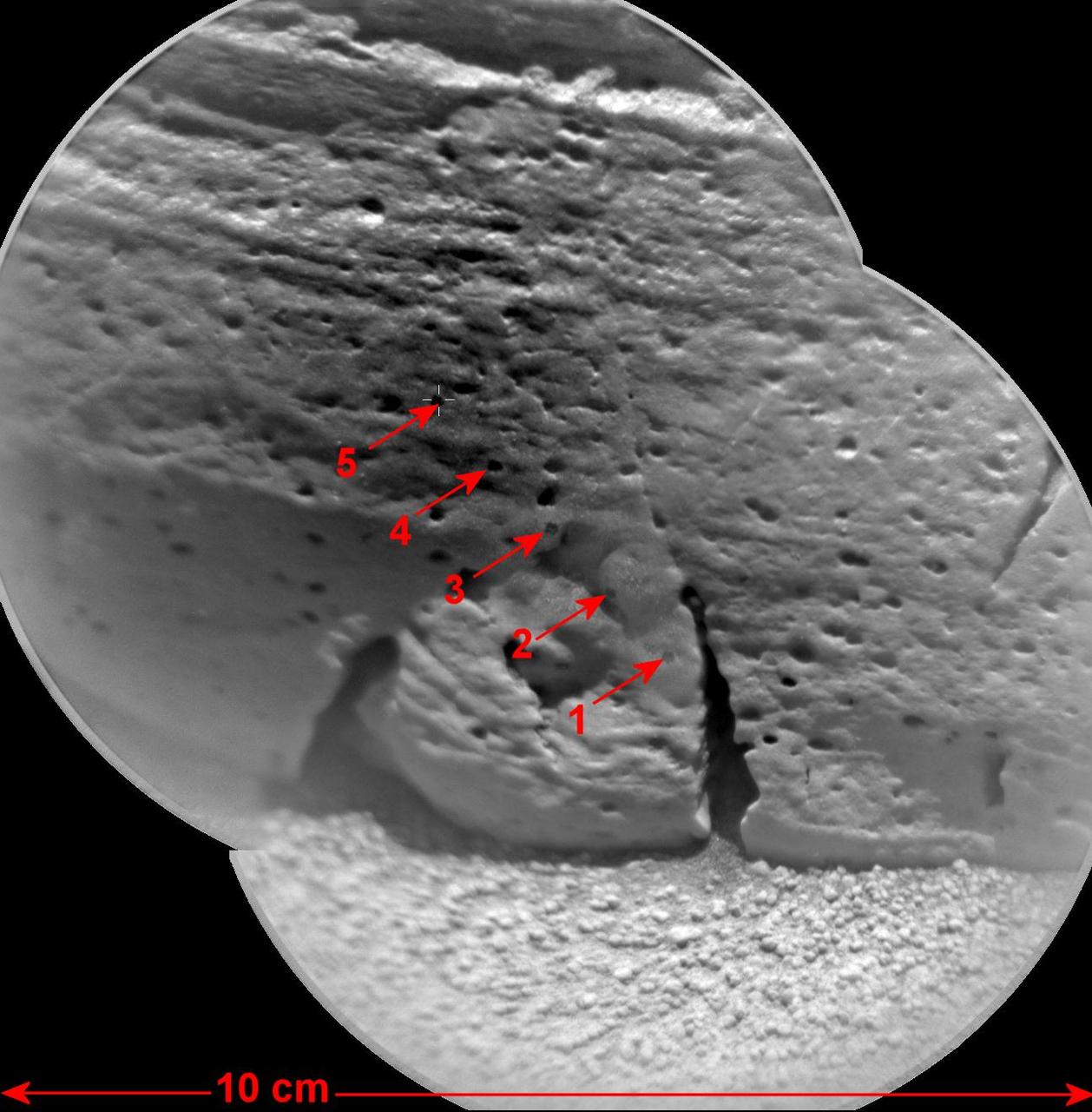 This view of a rock called Rocknest 3 combines two images taken by the Chemistry and Camera ChemCam instrument on the NASA Mars rover Curiosity and indicates five spots where ChemCam had hit the rock with laser pulses to check its composition.