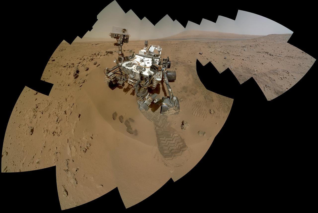 The mosaic shows NASA Curiosity rover at Rocknest, the spot in Gale Crater where the mission first scoop sampling took place. Four scoop scars can be seen in the regolith in front of the rover.