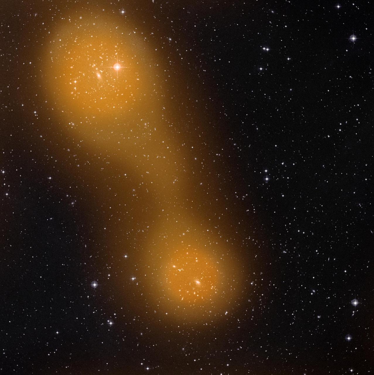 Planck has discovered a bridge of hot gas that connects galaxy clusters Abell 399 lower center and Abell 401 top left. The galaxy pair is located about a billion light-years from Earth.