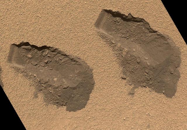 This is a view of the third left and fourth right trenches made by the 1.6-inch-wide 4-centimeter-wide scoop on NASA Mars rover Curiosity in October 2012 and shows some of the details regarding the properties of the Rocknest wind drift sand.