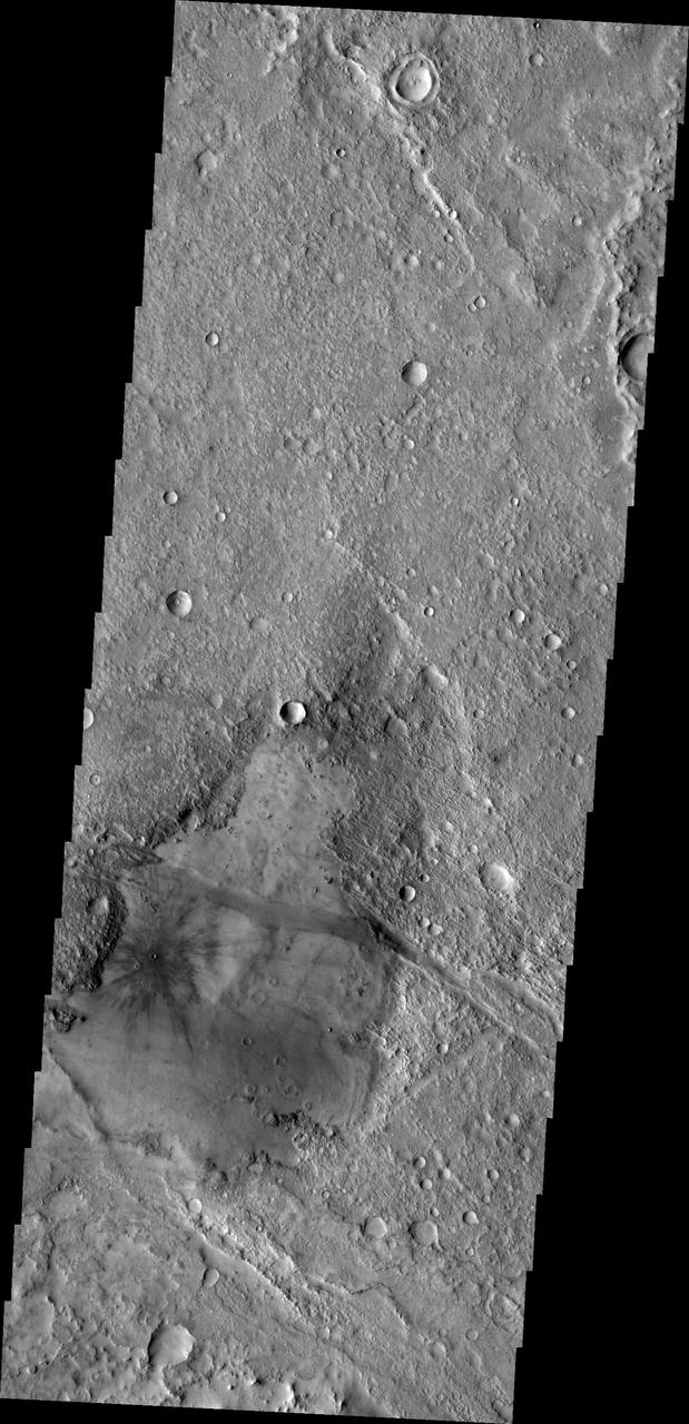 This image from NASA 2001 Mars Odyssey spacecraft shows a young crater. Dark radial spokes are created by the explosive blast of an impact event. With time, only thick ejecta near the rim of the crater will be visible, and dark spokes will disappear.