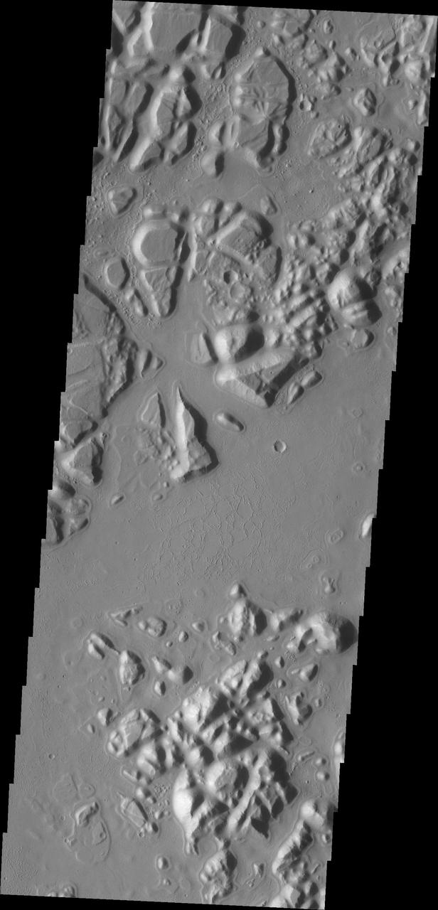 The hills and mesas in this image seen by NASA 2001 Mars Odyssey spacecraft are part of Echus Chaos.