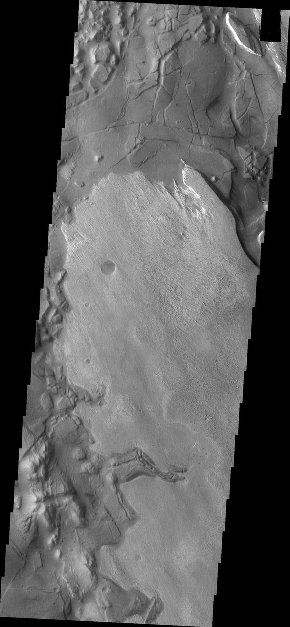This image captured by NASA 2001 Mars Odyssey spacecraft shows part of Aram Chaos. There are several layers of material in this region.