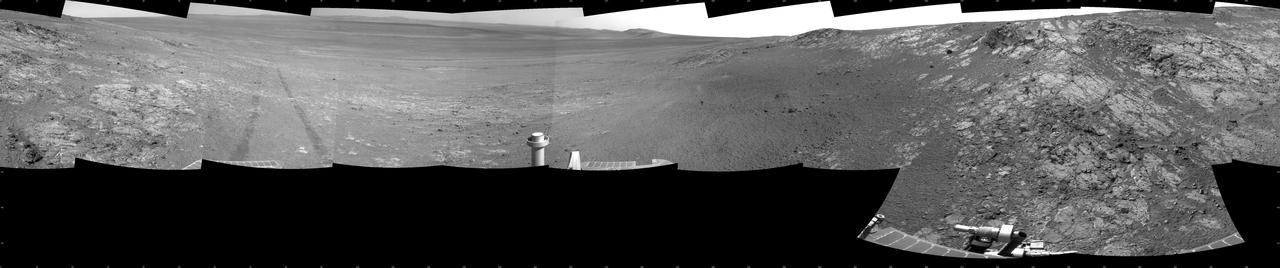 This full-circle, panorama shows the terrain around the NASA Mars Exploration Rover Opportunity on part of a relatively flat, light-toned outcrop called Whitewater Lake. The basin of Endeavour Crater is in the left half of the image.