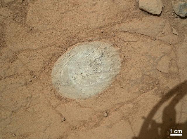 This image from the Mars Hand Lens Imager on NASA Mars rover Curiosity shows the patch of rock cleaned by the first use of the rover Dust Removal Tool DRT. The tool is a motorized, wire-bristle brush on the turret at the end of the rover arm.