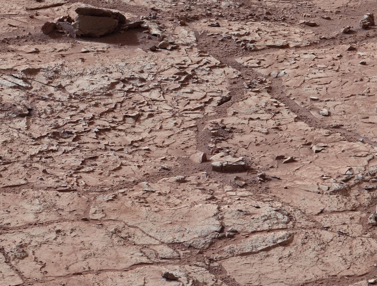 This view shows the patch of veined, flat-lying rock selected as the first drilling site for NASA Mars rover Curiosity.
