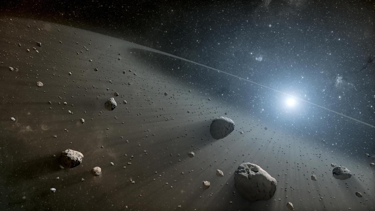 This artist concept illustrates an asteroid belt around the bright star Vega. Evidence for this warm ring of debris was found using NASA Spitzer Space Telescope, and the European Space Agency Herschel Space Observatory.