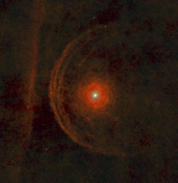 The red supergiant star Betelgeuse center is surrounded by a clumpy envelope of material in its immediate vicinity in this view from the Herschel Space Observatory.
