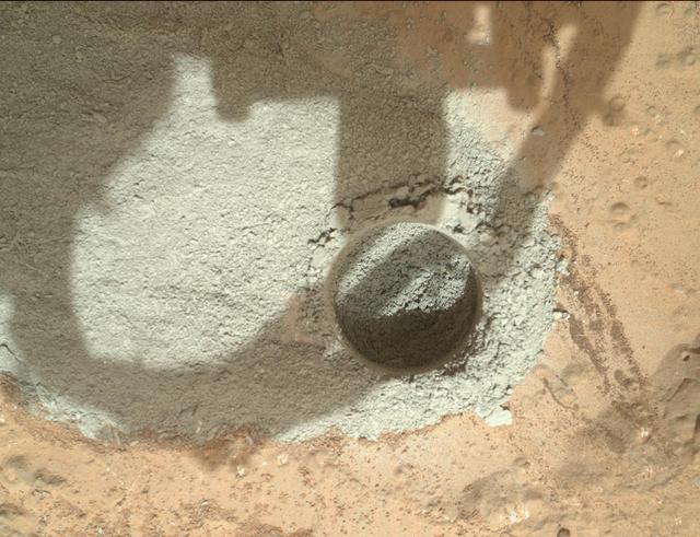 In an activity called the mini drill test, NASA Mars rover Curiosity used its drill to generate this ring of powdered rock for inspection in advance of the rover first full drilling.