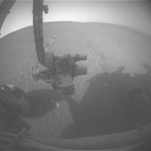 This image was taken by Opportunity front hazard-avoidance camera after the Sol 3309 drive, looking back at the tracks produced while the rover was driving in reverse, as it often does.