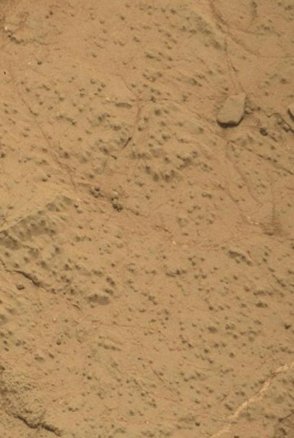 This image from the Mars Hand Lens Imager MAHLI on NASA Mars rover Curiosity shows the rock target Cumberland before and after Curiosity drilled into it to collect a sample for analysis.