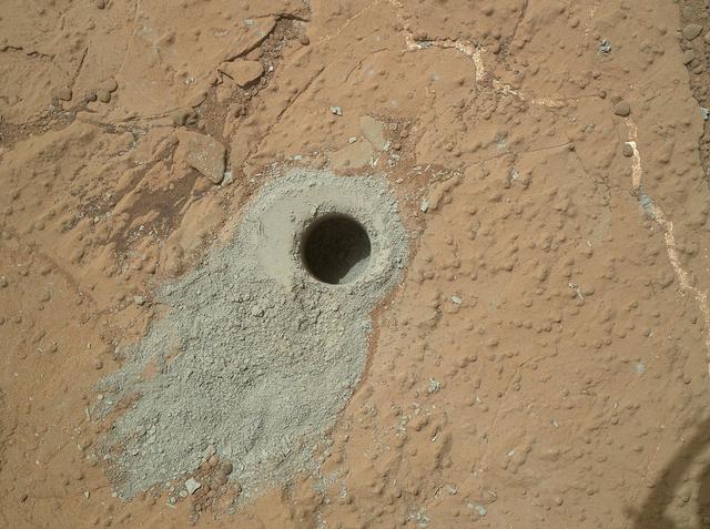 NASA Mars rover Curiosity drilled into this rock target, Cumberland, during the 279th Martian day, or sol, of the rover work on Mars May 19, 2013 and collected a powdered sample of material from the rock interior.