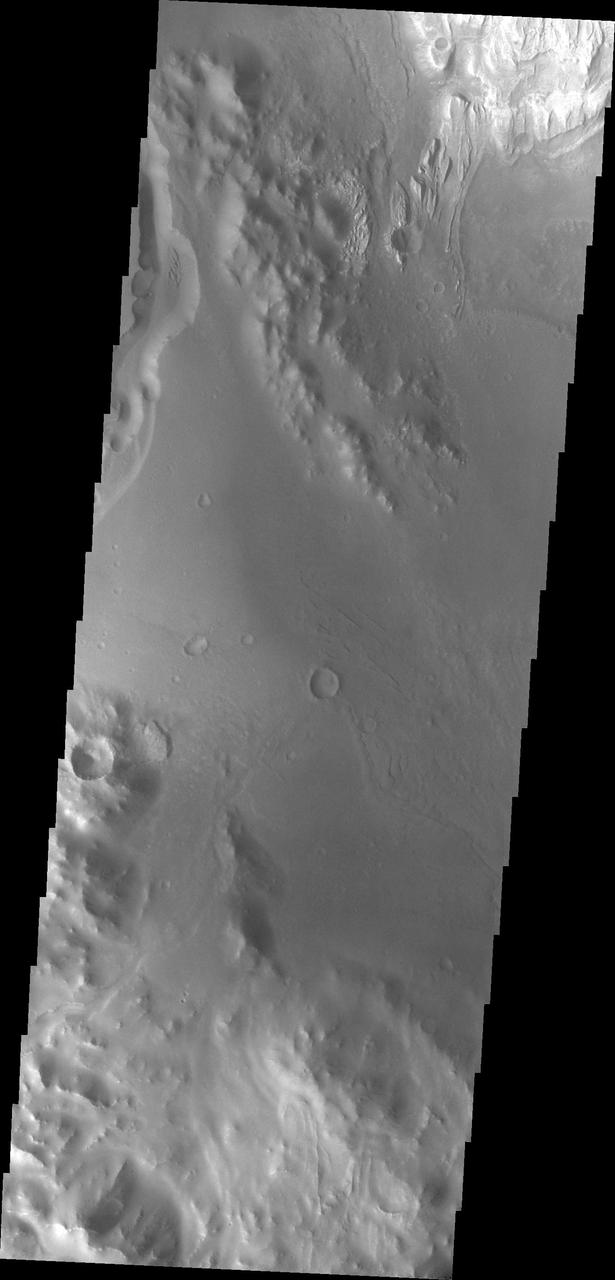 Backtracking a bit, this image from NASA Mars Odyssey spacecraft shows the large channel in the upper left of the frame. Just below the brighter material of Mt. Sharp is the start of the arced edge of material we saw in yesterday image top right.