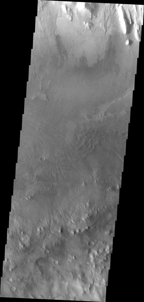 Moving further east, this image from NASA Mars Odyssey spacecraft shows the southern extent of Mt. Sharp as well as the crater floor and rim. In this image there are small dunes near Mt. Sharp as well as dunes near the crater rim.