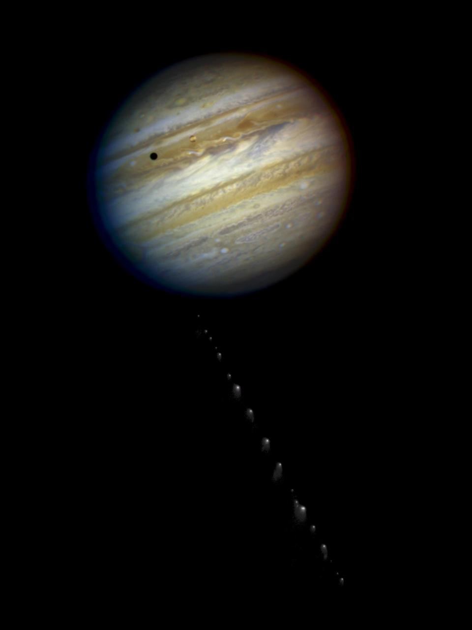 This is a composite photo, assembled from separate images of Jupiter and comet Shoemaker-Levy 9, as imaged by the NASA/ESA Hubble Space Telescope in 1994.