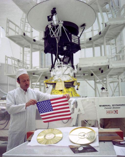 As NASA two Voyager spacecraft travel out into deep space, they carry a small American flag and a Golden Record packed with pictures and sounds -- mementos of our home planet.