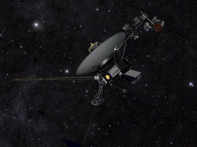 This artist concept shows NASA Voyager spacecraft against a field of stars in the darkness of space as they travel farther away from Earth, on a journey to interstellar space, and will eventually circle around the center of the Milky Way galaxy.