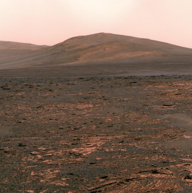 NASA Mars Exploration Rover Opportunity used its panoramic camera Pancam to acquire this view of Solander Point. The southward-looking scene, presented in true color, shows Solander Point on the center horizon.