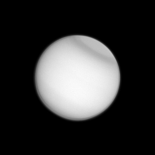 Titan polar collar, previously seen by Voyager 2 and the Hubble Space Telescope, has now been observed by the Cassini spacecraft, seen here in ultraviolet light. The collar is believed to be seasonal in nature.