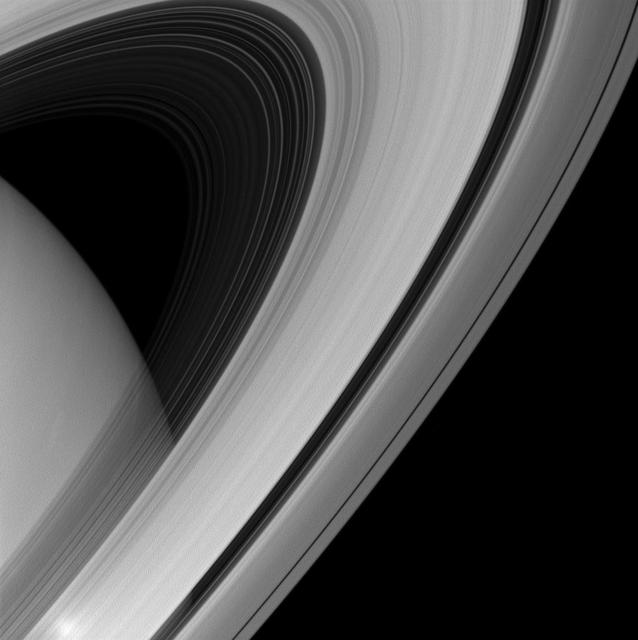 Saturn rings appear to form a majestic arc over the planet in this image from NASA Cassini spacecraft.