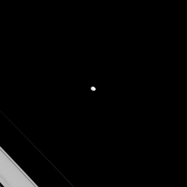 The irregularly shaped moon Janus keeps up its lonely orbit as seen by NASA Cassini spacecraft. Even though Janus shares its orbit with the moon Epimetheus, they never get very close to one another.