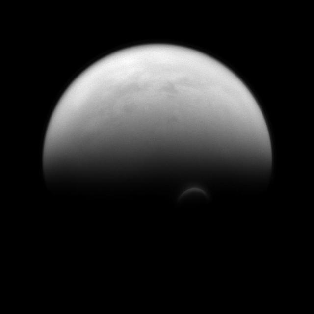 The sunlit edge of Titan south polar vortex stands out distinctly against the darkness of the moon unilluminated hazy atmosphere as seen by NASA Cassini spacecraft.