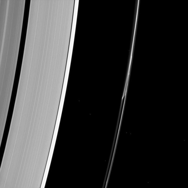 Saturn F ring often appears to do things other rings dont. In this image from NASA Cassini spacecraft, a strand of ring appears to separate from the core of the ring as if pulled apart by mysterious forces.