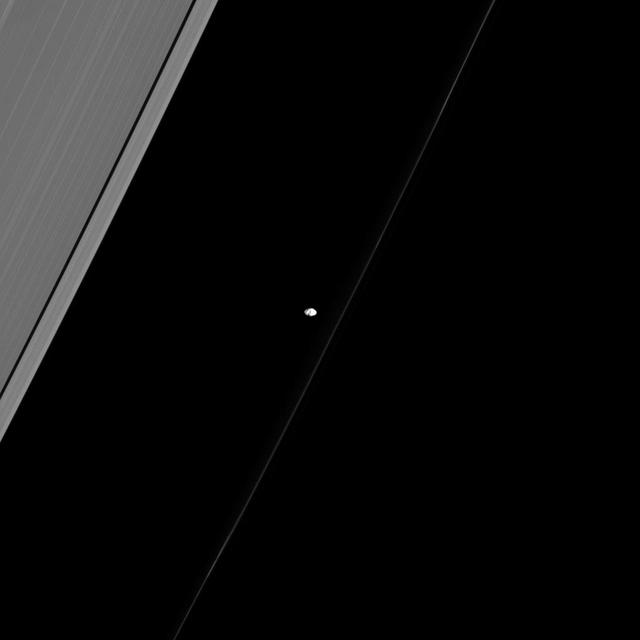 Similar to many of the small, inner moons of Saturn, Prometheus points its long axis at Saturn as if giving us directions to the planet. This image was taken by NASA Cassini spacecraft.