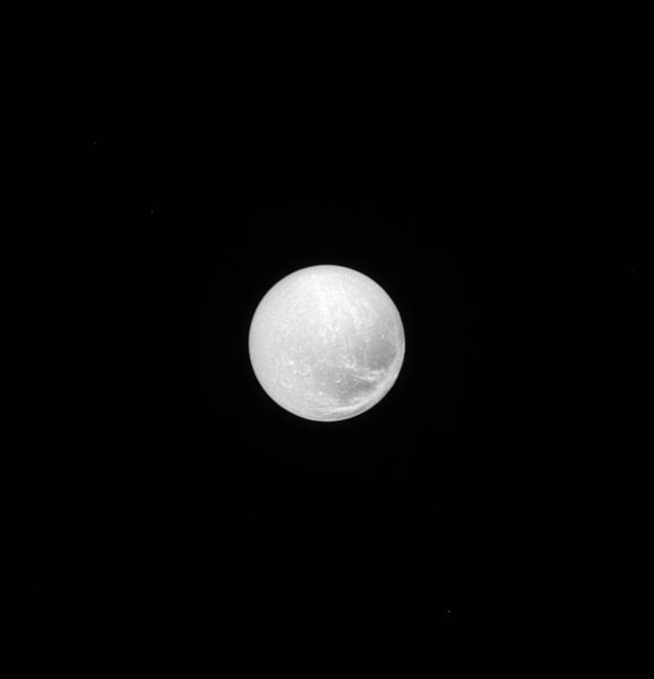 As seen by NASA Cassini spacecraft, the surface of Dione is covered in craters, reminding us of the impacts that have shaped all of the worlds of our solar system; the surface also bears linear features that suggest geological activity in the past.