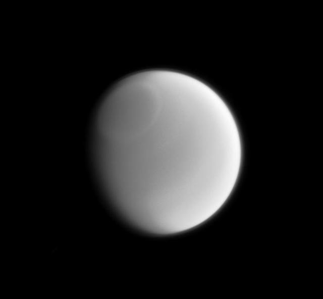 Only a sharp and careful eye can make out the subtle variations in Titan clouds when viewed in visible light by NASA Cassini spacecraft. This infrared image clearly reveals a band around the Titan north pole.