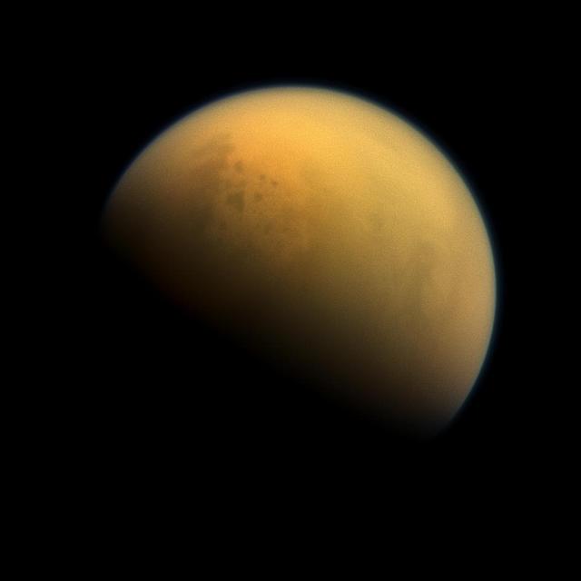 Using a special spectral filter, the high-resolution camera aboard NASA's Cassini spacecraft was able to peer through the hazy atmosphere of Saturn's moon Titan. It captured this image, which features the largest seas and some of the many hydrocarbon lakes that are present on Titan's surface. Titan is the only place in the solar system, other than Earth, that has stable liquids on its surface. In this case, the liquid consists of ethane and methane rather than water.   This view looks towards the side of Titan (3,200 miles or 5,150 kilometers across) that leads in its orbit around Saturn. North on Titan is up and rotated 36 degrees to the left. Images taken using red, green and blue spectral filters were combined to create this natural-color view. The images were taken with the Cassini spacecraft narrow-angle camera on Oct. 7, 2013.  The view was acquired at a distance of approximately 809,000 miles (1.303 million kilometers) from Titan. Image scale is 5 miles (8 kilometers) per pixel.  http://photojournal.jpl.nasa.gov/catalog/PIA17179
