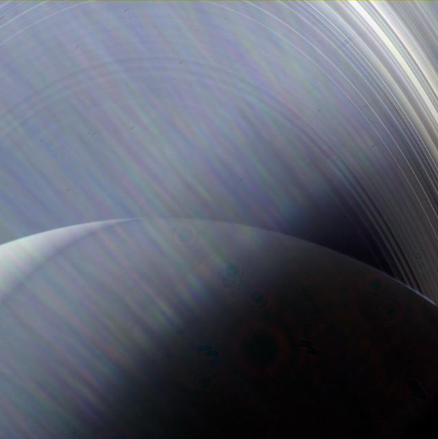 In this image, NASA's Cassini sees Saturn and its rings through a haze of Sun glare on the camera lens. If you could travel to Saturn in person and look out the window of your spacecraft when the Sun was at a certain angle, you might see a view very similar to this one. Images taken using red, green and blue spectral filters were combined to show the scene in natural color. The images were taken with Cassini's wide-angle camera on June 23, 2013, at a distance of approximately 491,200 miles (790,500 kilometers) from Saturn. The Cassini spacecraft ended its mission on Sept. 15, 2017. https://photojournal.jpl.nasa.gov/catalog/PIA17185