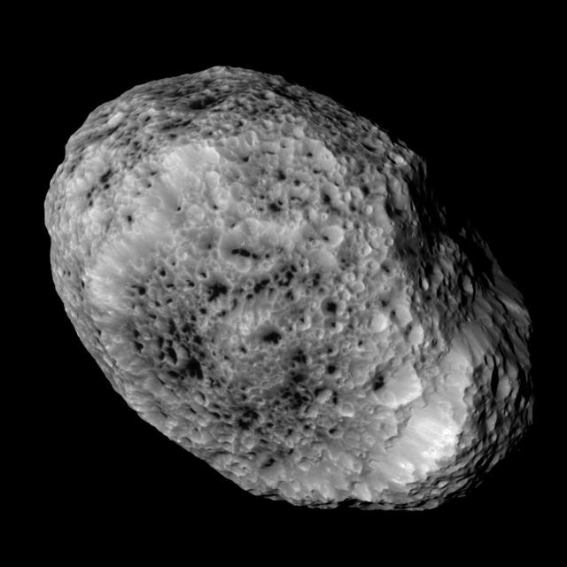 NASA Cassini imaging scientists processed this view of Saturn moon Hyperion, taken during a close flyby on May 31, 2015. This flyby marks the mission final close approach to Saturn largest irregularly shaped moon.