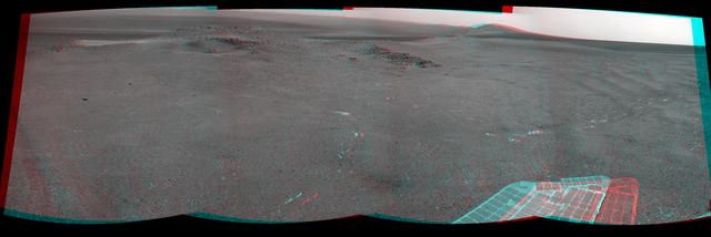 NASA Mars Exploration Rover Opportunity recorded this 3D view of a rise called Nobbys Head during a stop on a multi-week southward drive between two raised segments of the west rim of Endeavour Crater.